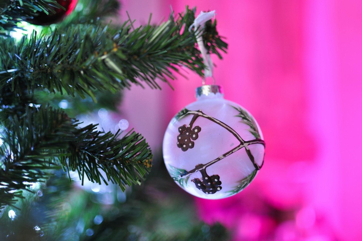 Christmas Trees decoration hangs on the branch, close-up